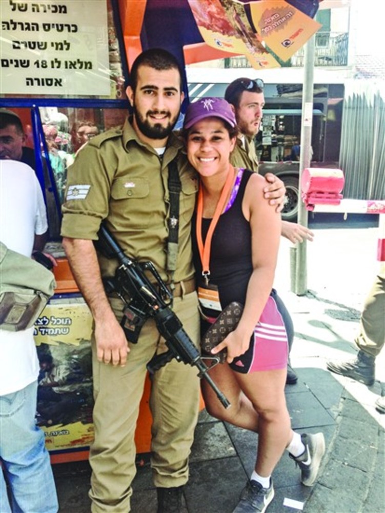 Lexi Kutemplon-Rayess with one of the Israeli soldiers  on her trip.